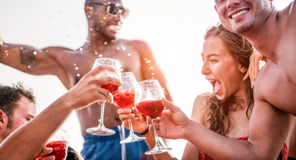 Happy,Friends,Drinking,Sangria,Wine,At,Exclusive,Boat,Party,-