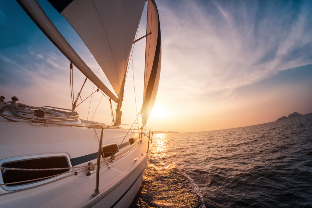 Sail,Boat,With,Set,Up,Sails,Gliding,In,Open,Sea
